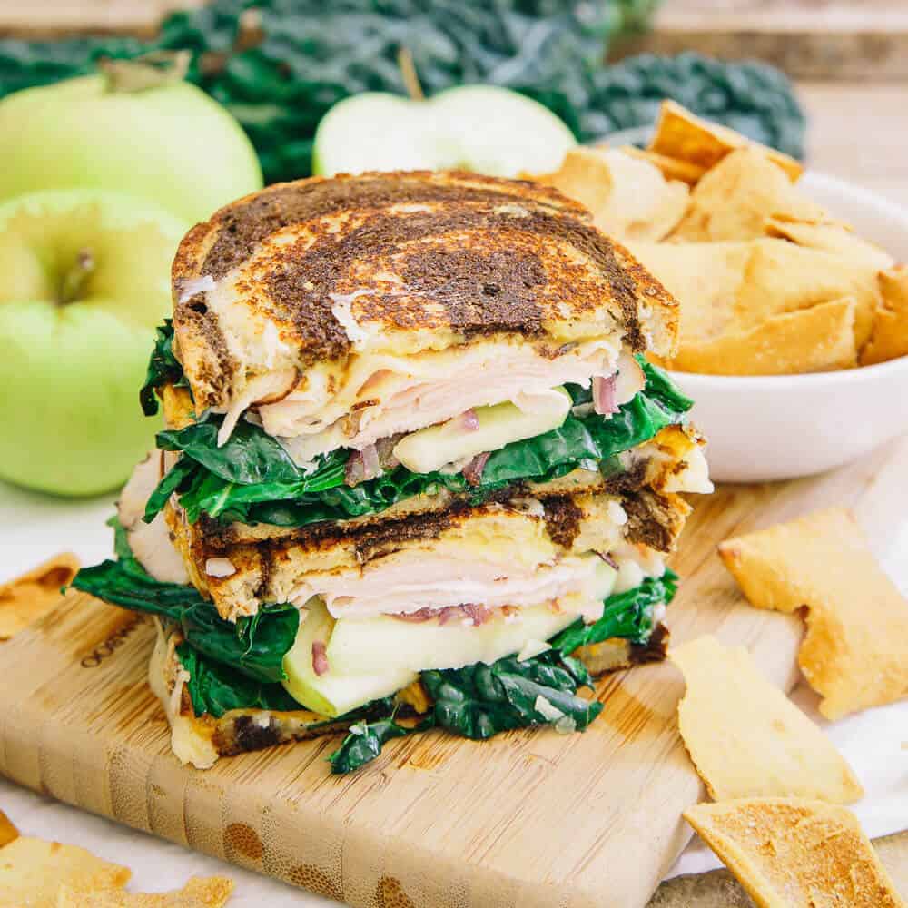 This roasted sweet potato apple ham sandwich is served hot and pressed with a generous amount of melted cheddar cheese and a honey mustard spread. There's a ton going on and you'll love every bite!