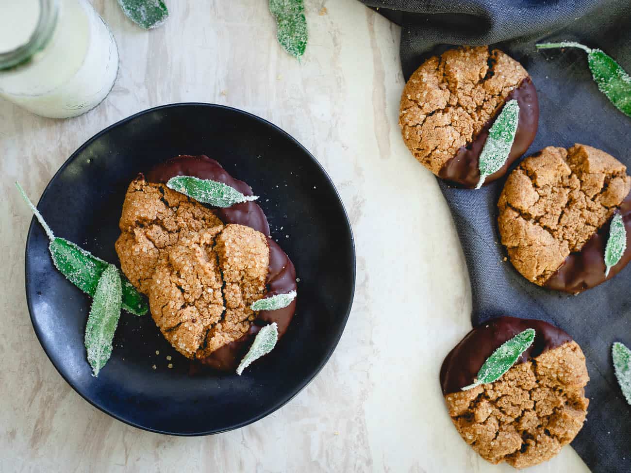 These flourless cashew almond butter cookies are soft, chewy and full of festive fun with their candied sage garnish.