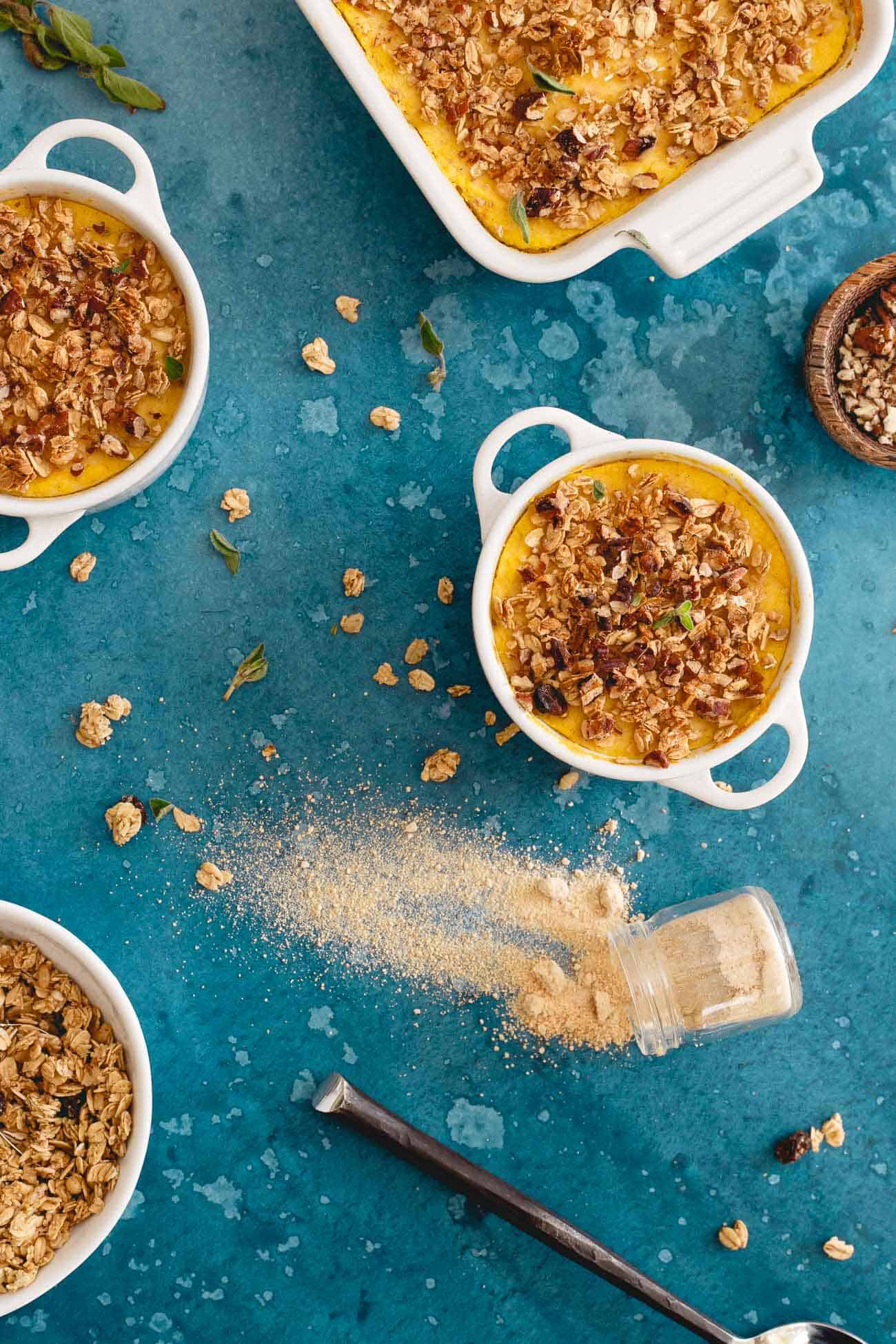 This cauliflower pumpkin mash is made with creamy marscapone and topped with vanilla granola and pecans. A healthier alternative to sweet potato casserole!