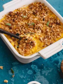 This cauliflower pumpkin mash is made with creamy mascarpone and topped with vanilla granola and pecans. A healthier alternative to sweet potato casserole!