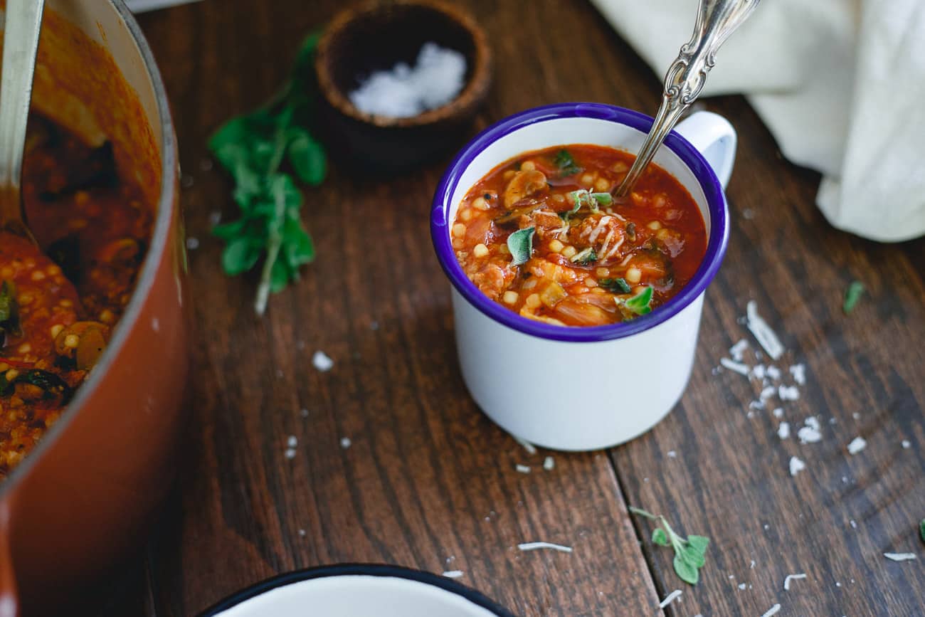 Filled with beef, sausage, mushrooms and escarole, this Italian Tomato Pasta Soup recipe is an outrageously comforting meal.