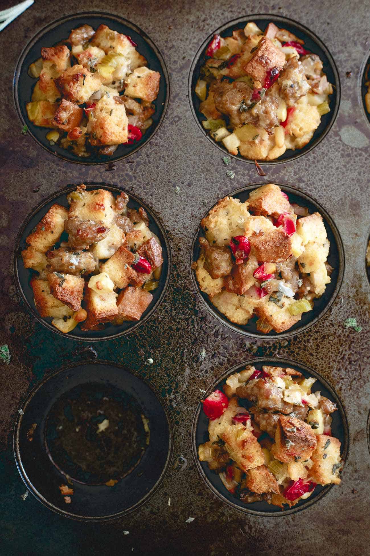 Gluten free stuffing muffins resting in the pan.