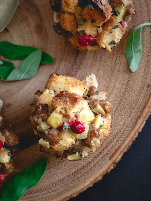 These gluten free stuffing muffins are filled with sweet Italian sausage, apples, cranberries, sage and pine nuts for a fun alternative to traditional stuffing!