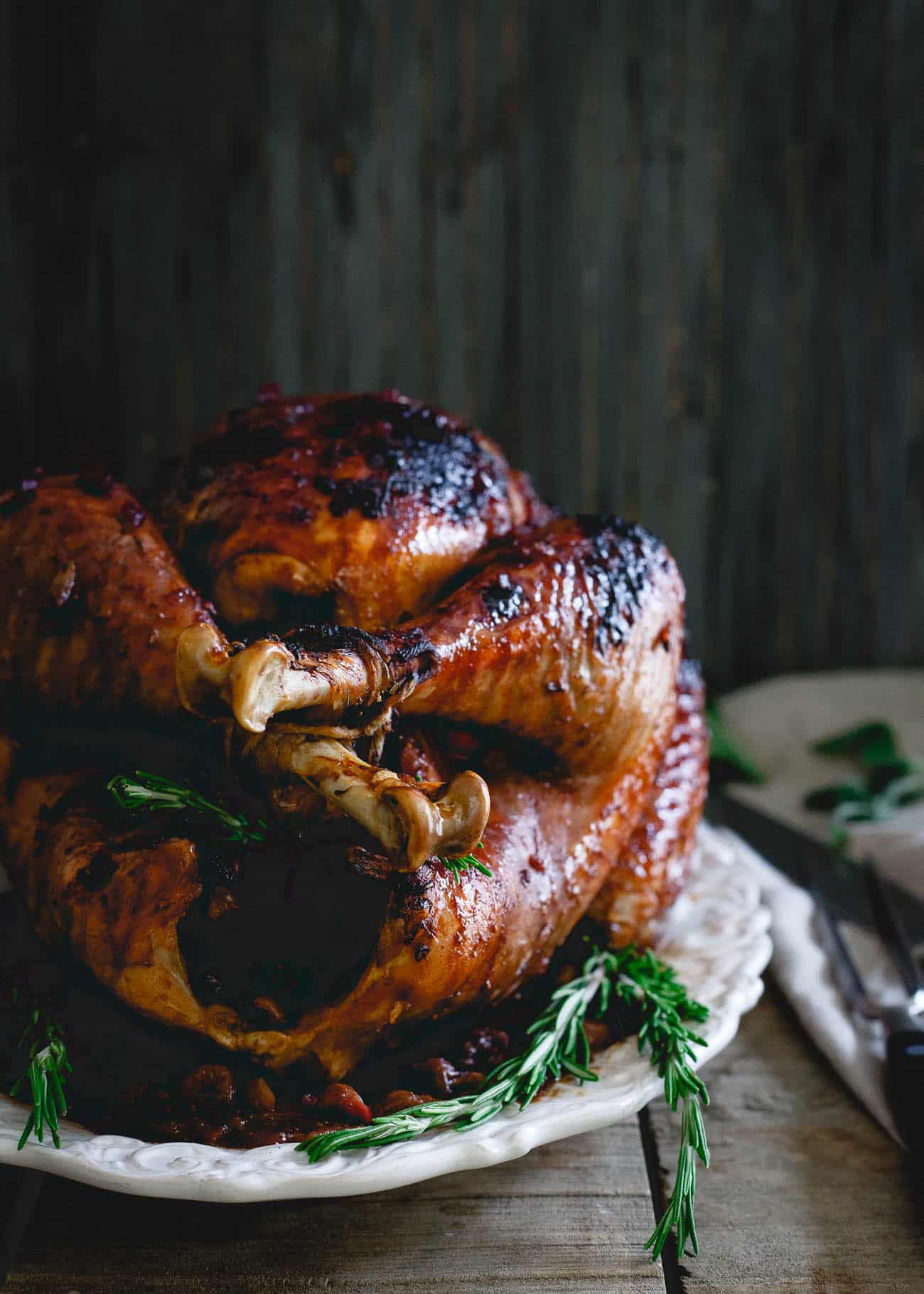 This cherry cranberry glazed turkey is perfect for your Thanksgiving table. The slightly sweet and sticky glaze gives the bird tons of festive flavor!
