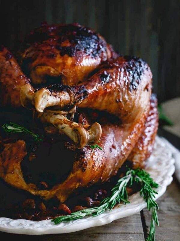 This cherry cranberry glazed turkey is perfect for your Thanksgiving table. The slightly sweet and sticky glaze gives the bird tons of festive flavor!