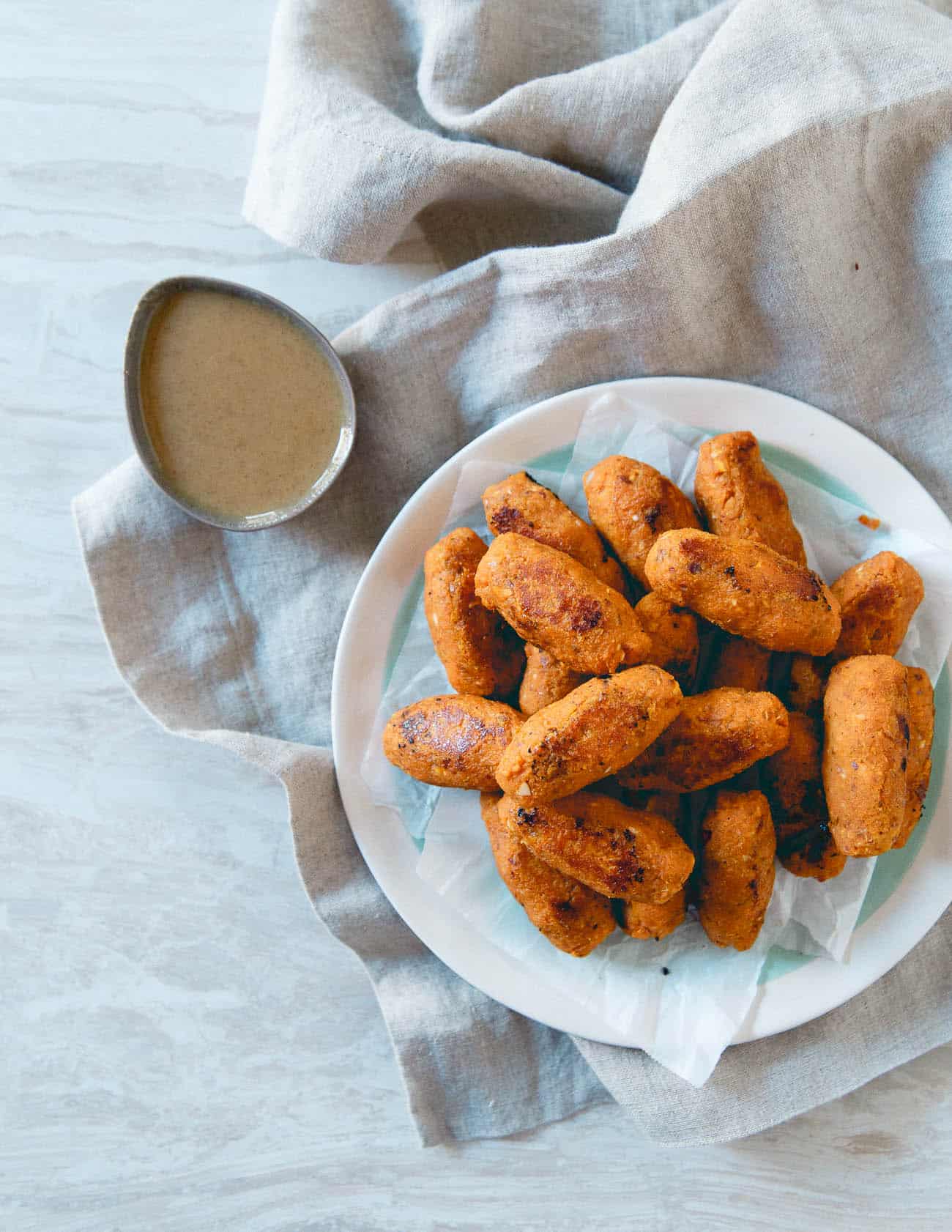 These baked sweet potato tots with dijon maple dipping sauce make a great healthy, fall appetizer.