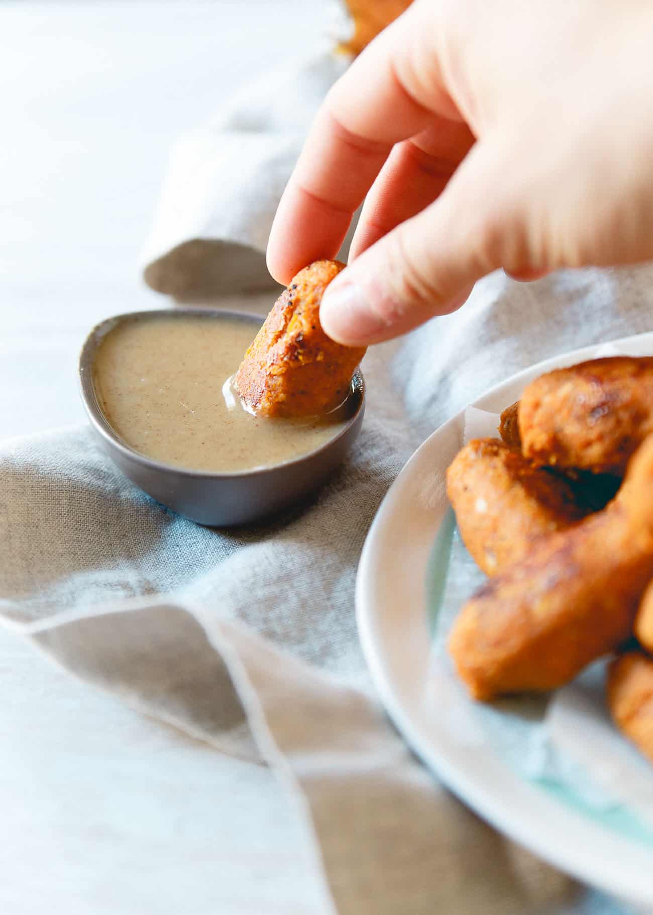 Looking for a healthier fall appetizer? These baked sweet potato tots with maple dijon dipping sauce are the perfect fit!