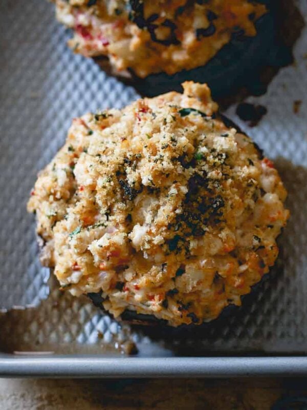 These turkey stuffed portobello mushrooms have creamy black garlic cheese, spinach, onions and roasted red peppers for an easy and unbelievably tasty dinner!