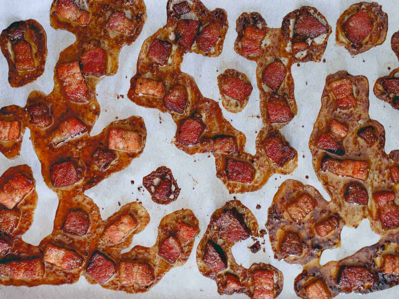 Candied bacon gets paired with maple candied pecans and walnuts for a delicious holiday brittle!