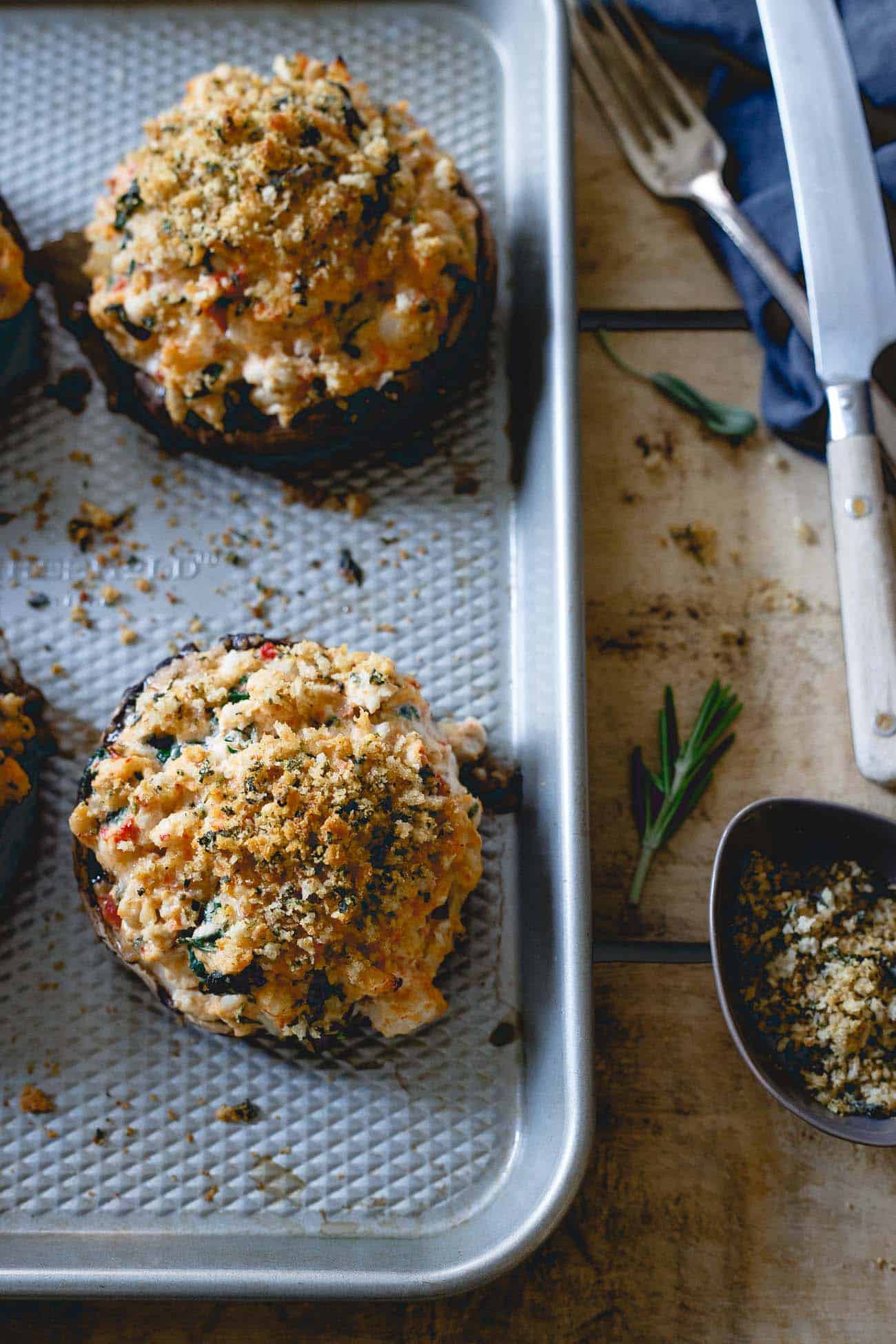 Turkey stuffed mushrooms on a baking sheet after cooking.