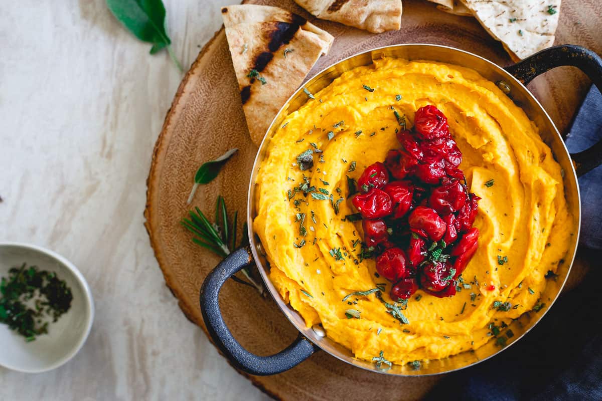 People won't be able to keep their hands out of this festive butternut squash goat cheese dip!