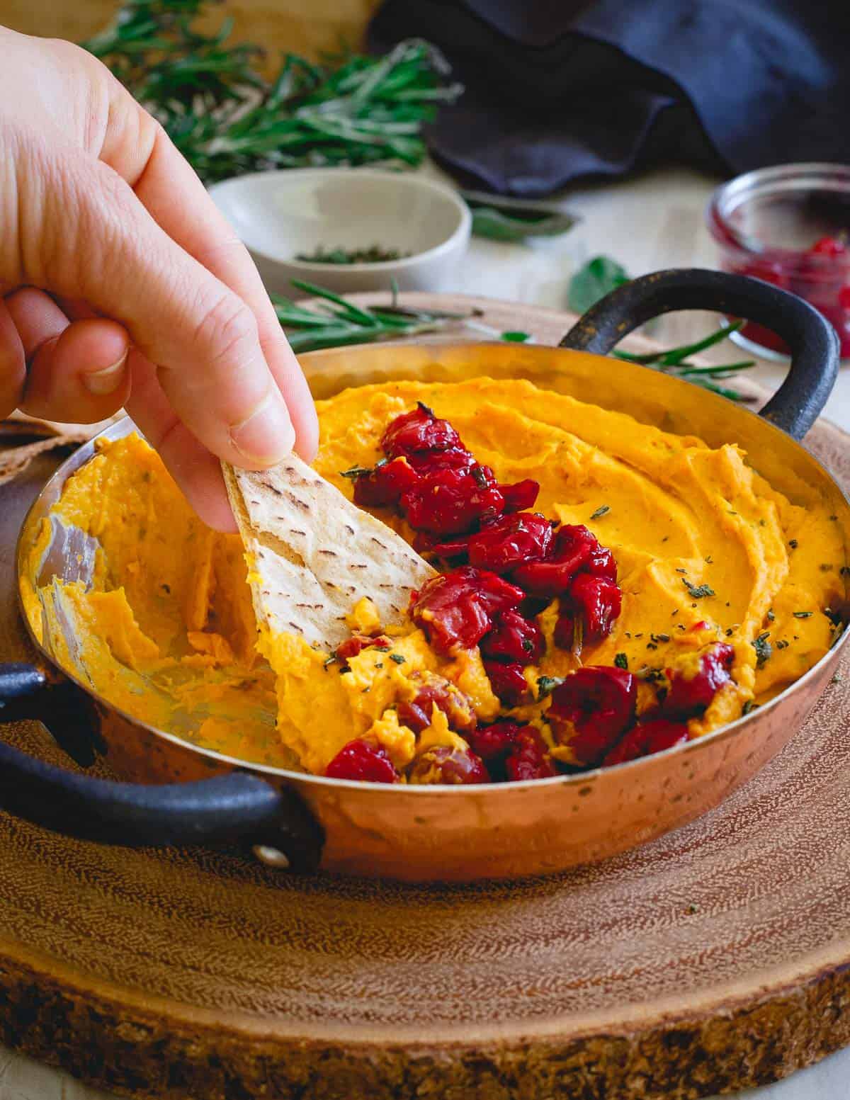 Tart cherries and herbs complement this creamy goat cheese butternut squash dip perfectly.
