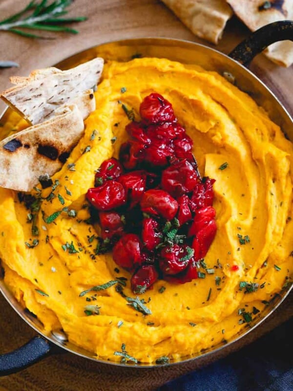 This butternut squash dip is made with goat cheese and cream cheese for a super creamy texture then topped with a festive Montmorency tart cherry compote. Serve it with some pita chips for the perfect holiday appetizer!