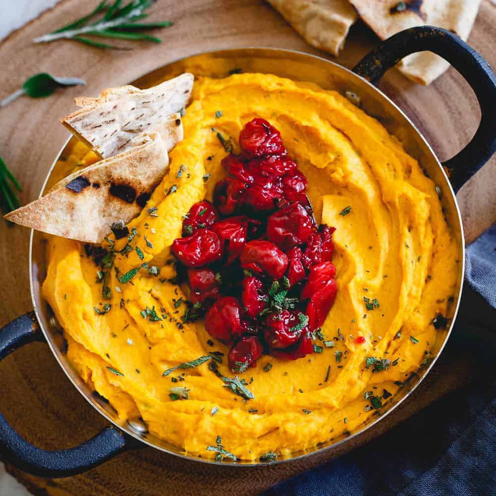 This butternut squash dip is made with goat cheese and cream cheese for a super creamy texture then topped with a festive Montmorency tart cherry compote. Serve it with some pita chips for the perfect holiday appetizer!
