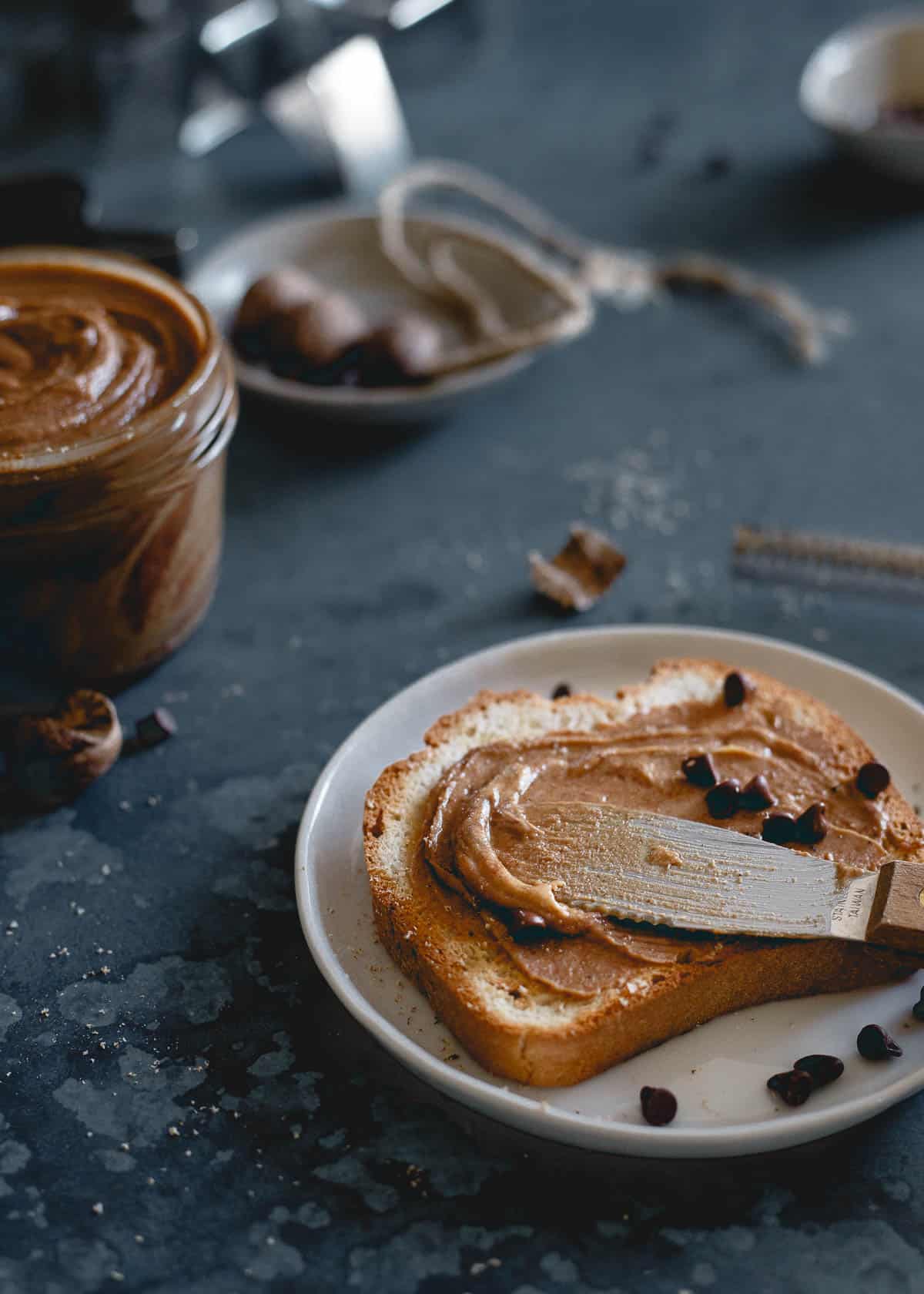 Creamy gingerbread peanut butter on toast with mini chocolate chips.