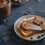 This creamy gingerbread peanut butter is made with molasses roasted peanuts, holiday spices and optional chocolate chips. Enjoy it this holiday season on toast, dolloped in oatmeal or straight from the jar with a spoon!