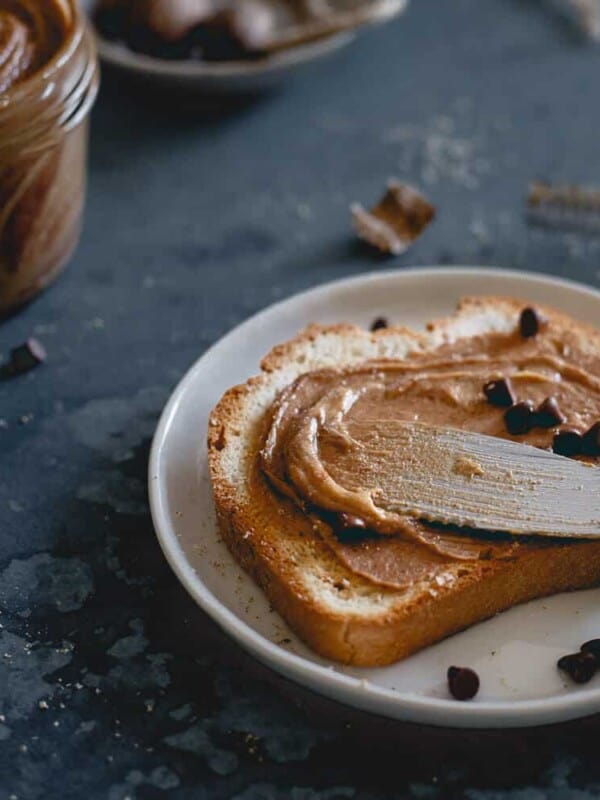 This creamy gingerbread peanut butter is made with molasses roasted peanuts, holiday spices and optional chocolate chips. Enjoy it this holiday season on toast, dolloped in oatmeal or straight from the jar with a spoon!