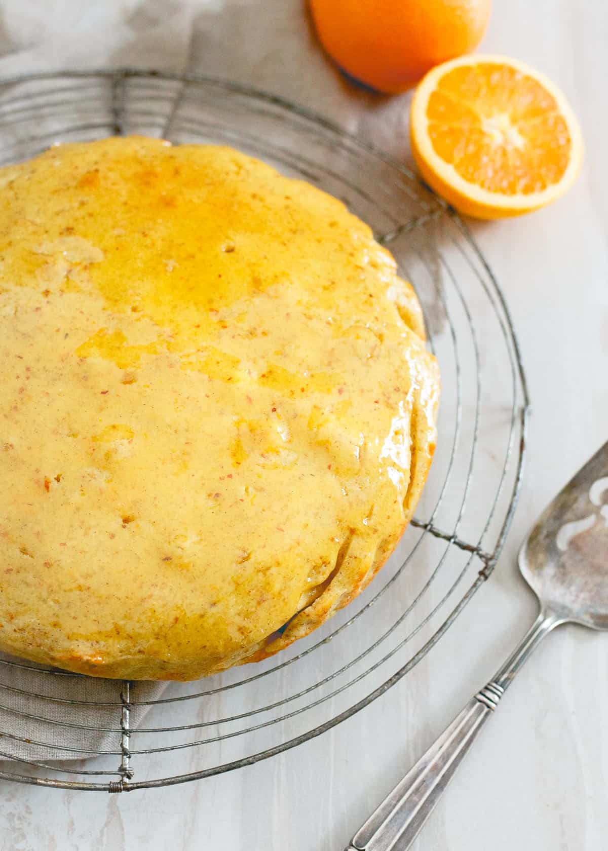 This glazed orange cardamom cake is a wonderfully simple dessert bursting with winter citrus and spice, perfect for your holiday table.