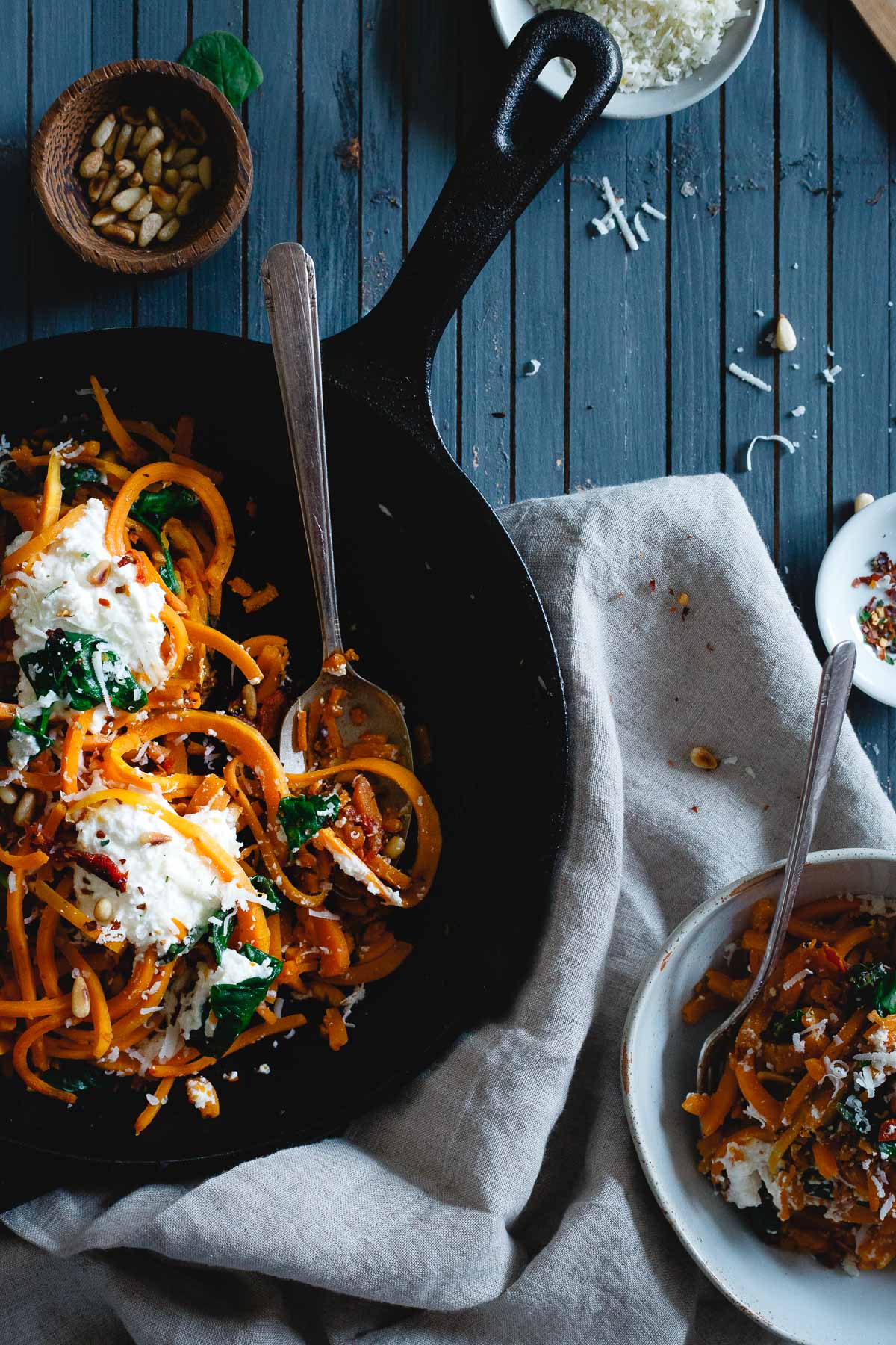 Garlicky butternut squash noodles with spinach, ricotta and pine nuts prove that vegetarian food can definitely be comforting too!