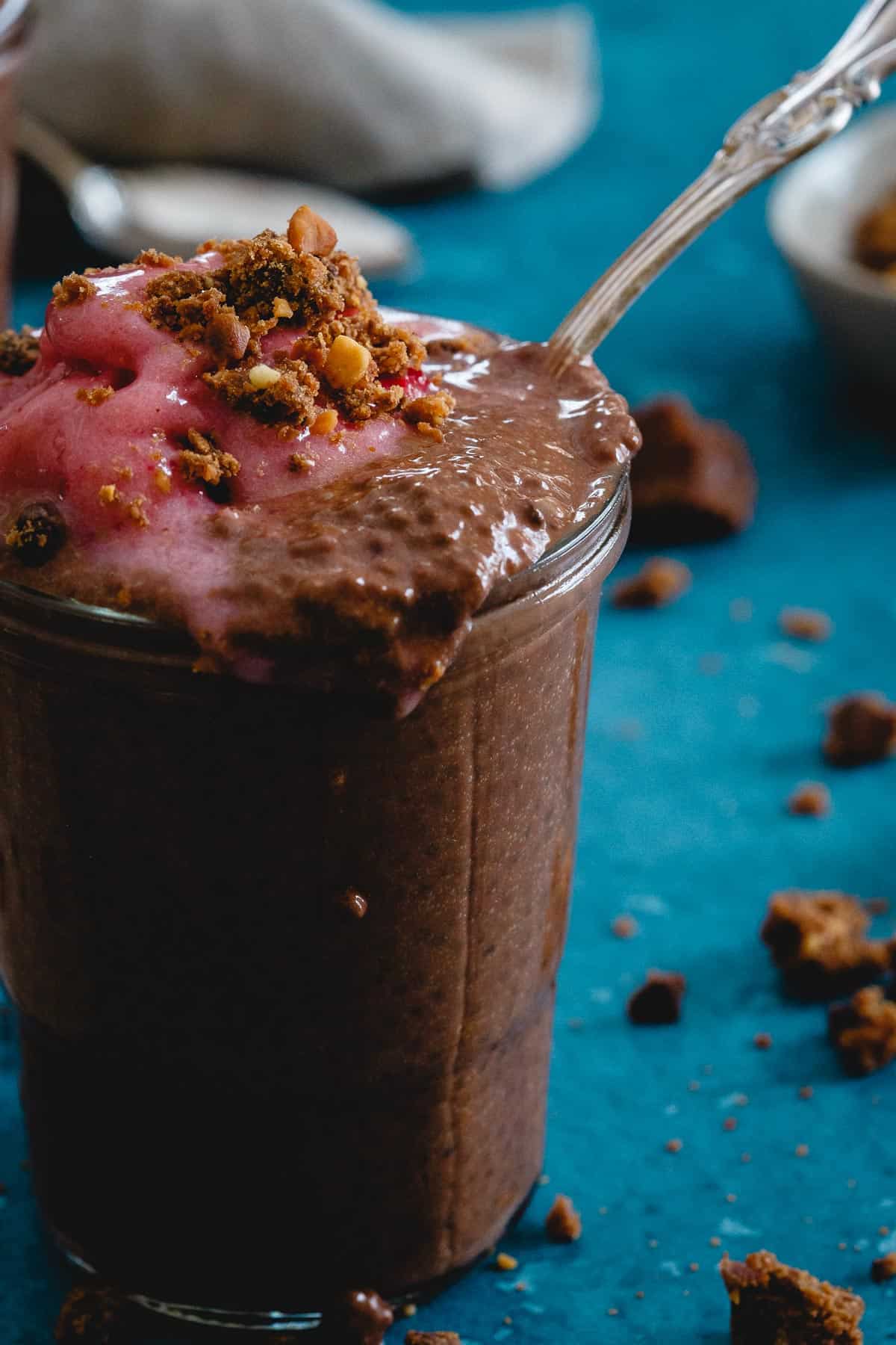 Snack healthy with this peanut butter chocolate chia parfait. Peanut butter chocolate crumbles and whipped frozen strawberries take it over the edge!