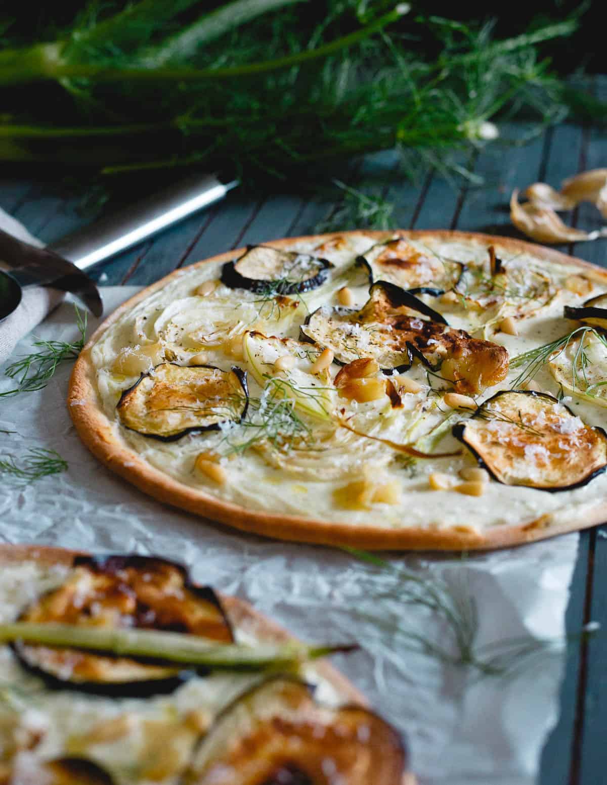 With a premade gluten-free crust, this roasted eggplant fennel pizza is an easy weeknight meal!