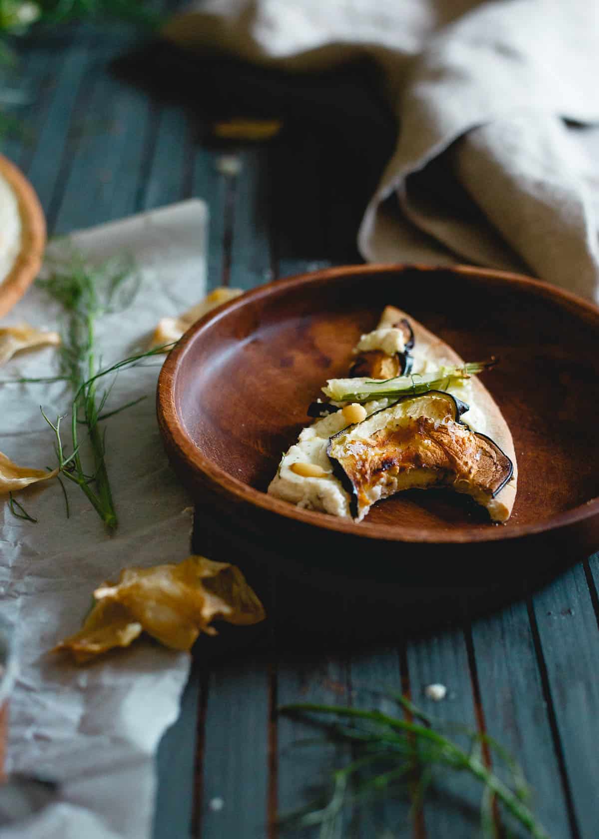 With tons of roasted garlic, whipped feta, eggplant and fennel, this pizza is the ultimate winter indulgence!