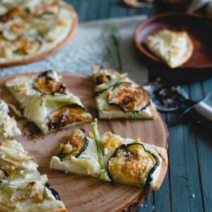 If you love white pizza, you'll love this roasted eggplant fennel pizza! It has a whipped feta and ricotta base with toasted pine nuts, creamy roasted garlic cloves and an olive oil drizzle to top it off.