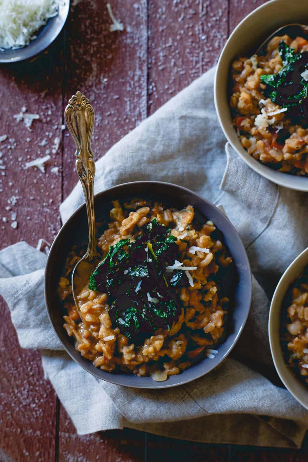 This Tuscan white bean farro risotto is warm, comforting, hearty and a healthy way to ring in the New Year. Made using Tuscan white bean soup, it’s packed with way more flavor than your typical risotto.