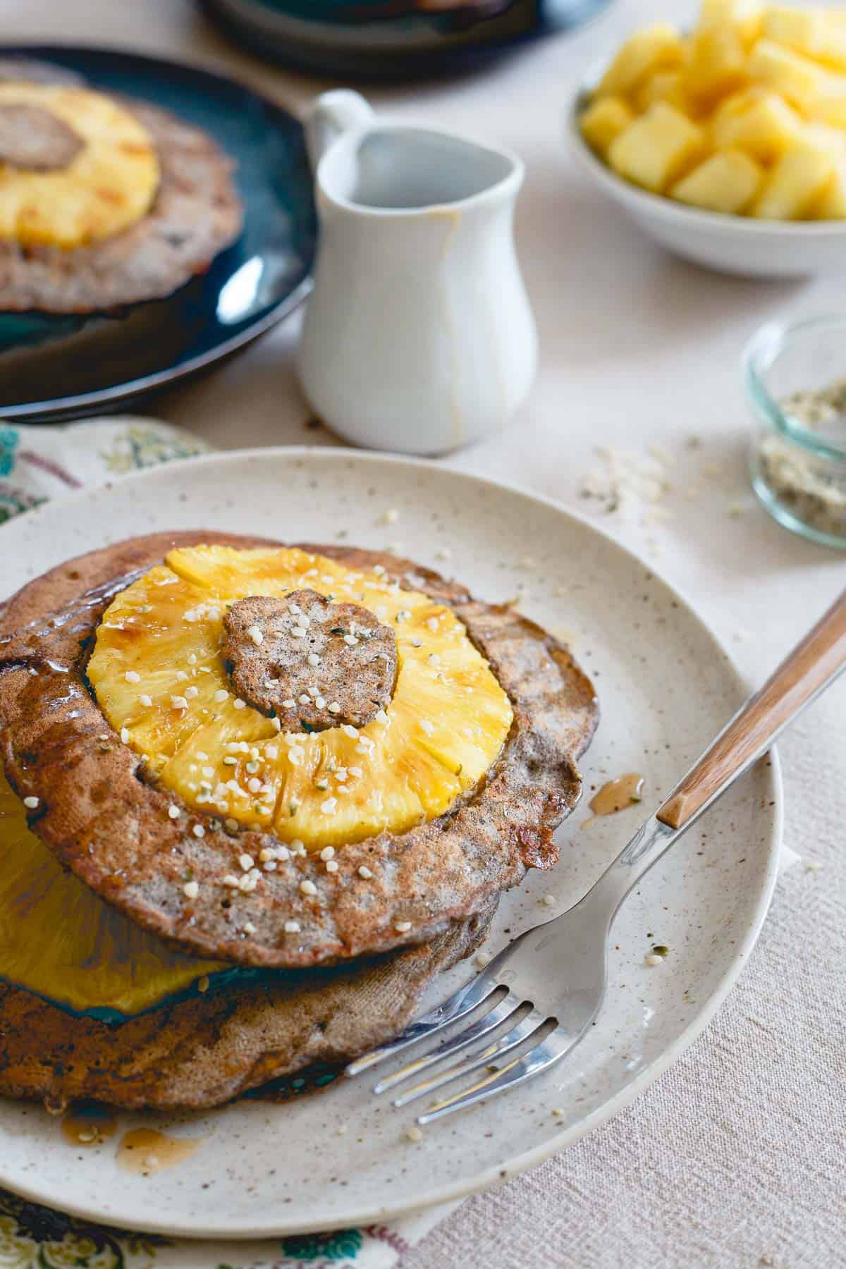 These pineapple buckwheat pancakes are studded with hemp seeds and whole rings of fresh pineapple. They're the perfect balance between hearty and sweet.