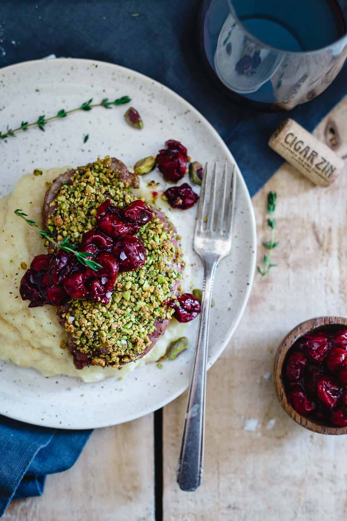 These pistachio crusted lamb chops with red wine cherries are a simple, yet elegant dinner sure to impress that special someone.