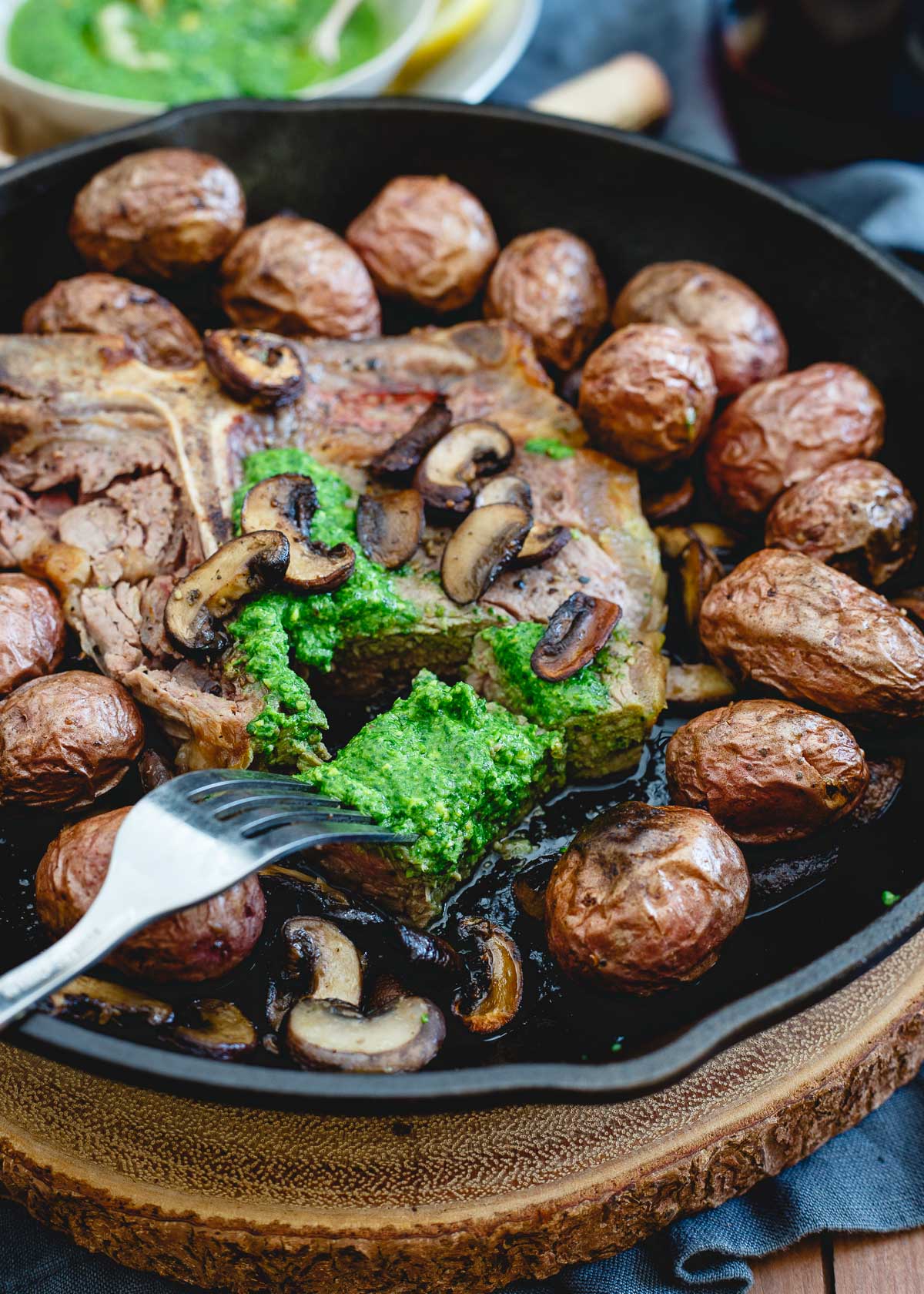 This easy Porterhouse steak skillet is topped with a spinach horseradish pesto for a pop of brightness.