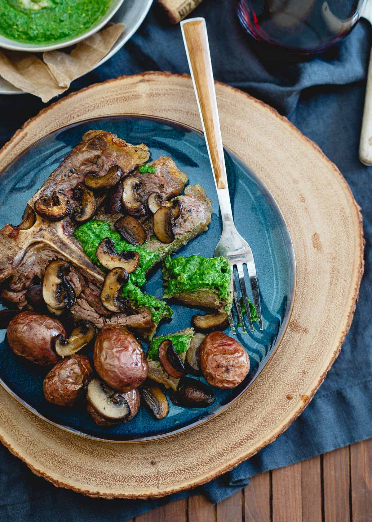 This porterhouse steak skillet has roasted baby red potatoes and mushrooms all made in the same pan for an easy, impressive dinner.