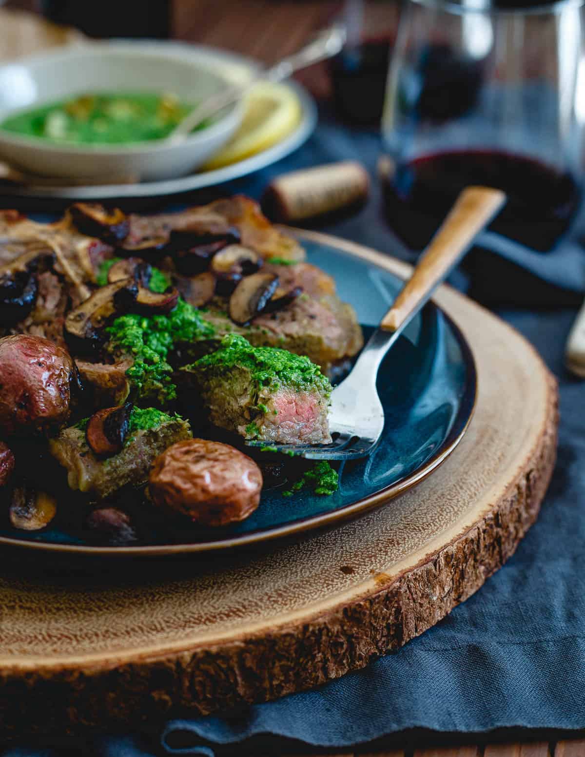 Everything is cooked in one skillet for this Porterhouse steak skillet then topped with a bright and spicy spinach horseradish pesto.