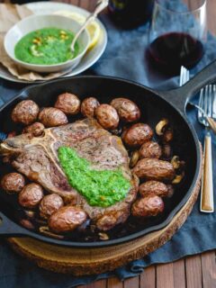 Everything is cooked in one skillet for this Porterhouse steak skillet then topped with a bright and spicy spinach horseradish pesto.