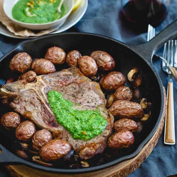 Everything is cooked in one skillet for this Porterhouse steak skillet then topped with a bright and spicy spinach horseradish pesto.