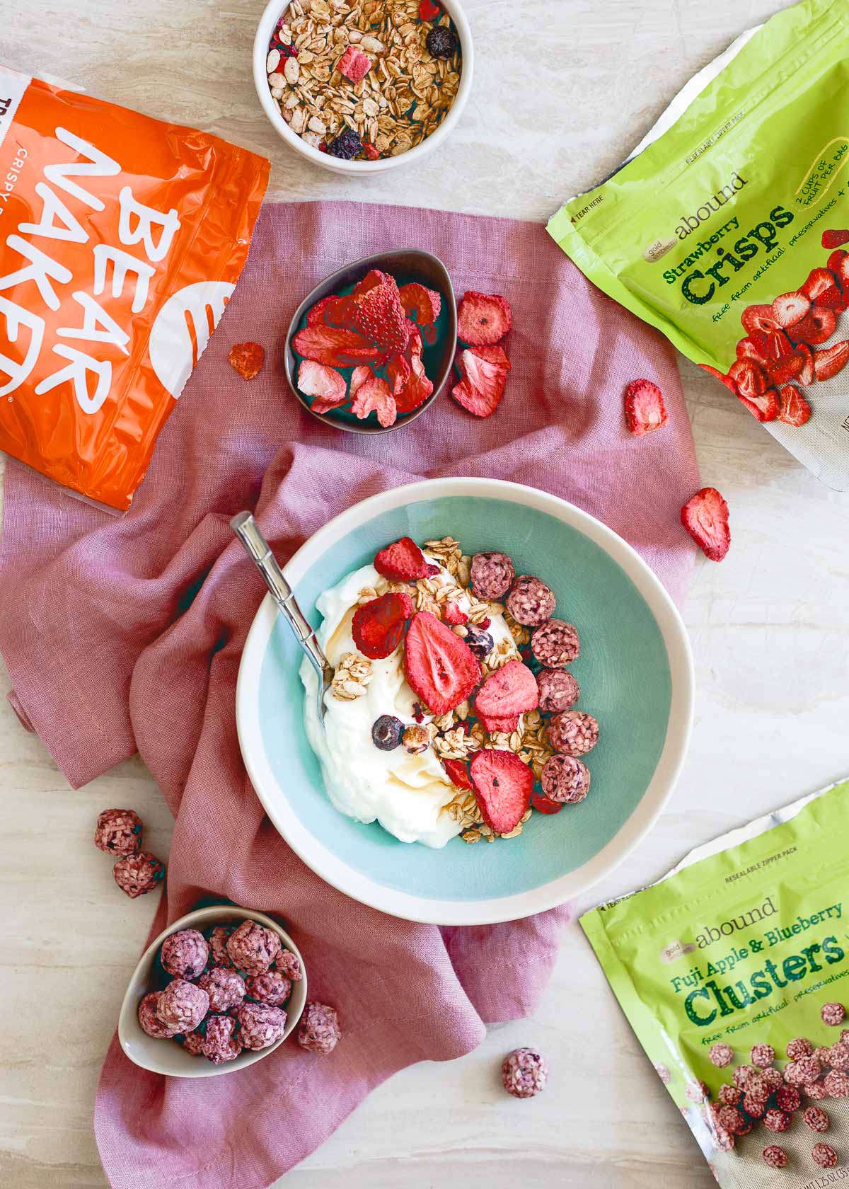 Greek yogurt, freeze dried fruit and granola are a simple and easy idea for a healthy afternoon snack to satisfy any sweet craving.