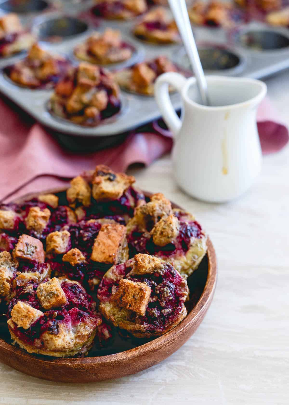These cinnamon raisin French toast bites are bursting with fresh blackberry ginger sauce. Baked in a mini-muffin tin, they're the perfect size for breakfast on the go!