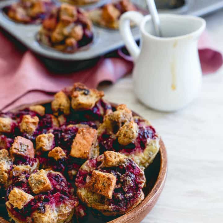 These cinnamon raisin French toast bites are bursting with fresh blackberry ginger sauce. Baked in a mini-muffin tin, they're the perfect size for breakfast on the go!