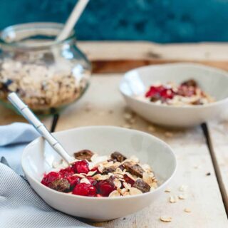 These breakfast yogurt bowls are topped with a tart cherry ginger muesli. Loaded with oats, almonds, cacao nibs, ginger, dried tart cherries and warm spices. With a swirl of cherry sauce, it's a tasty and nutritious way to start the day. 