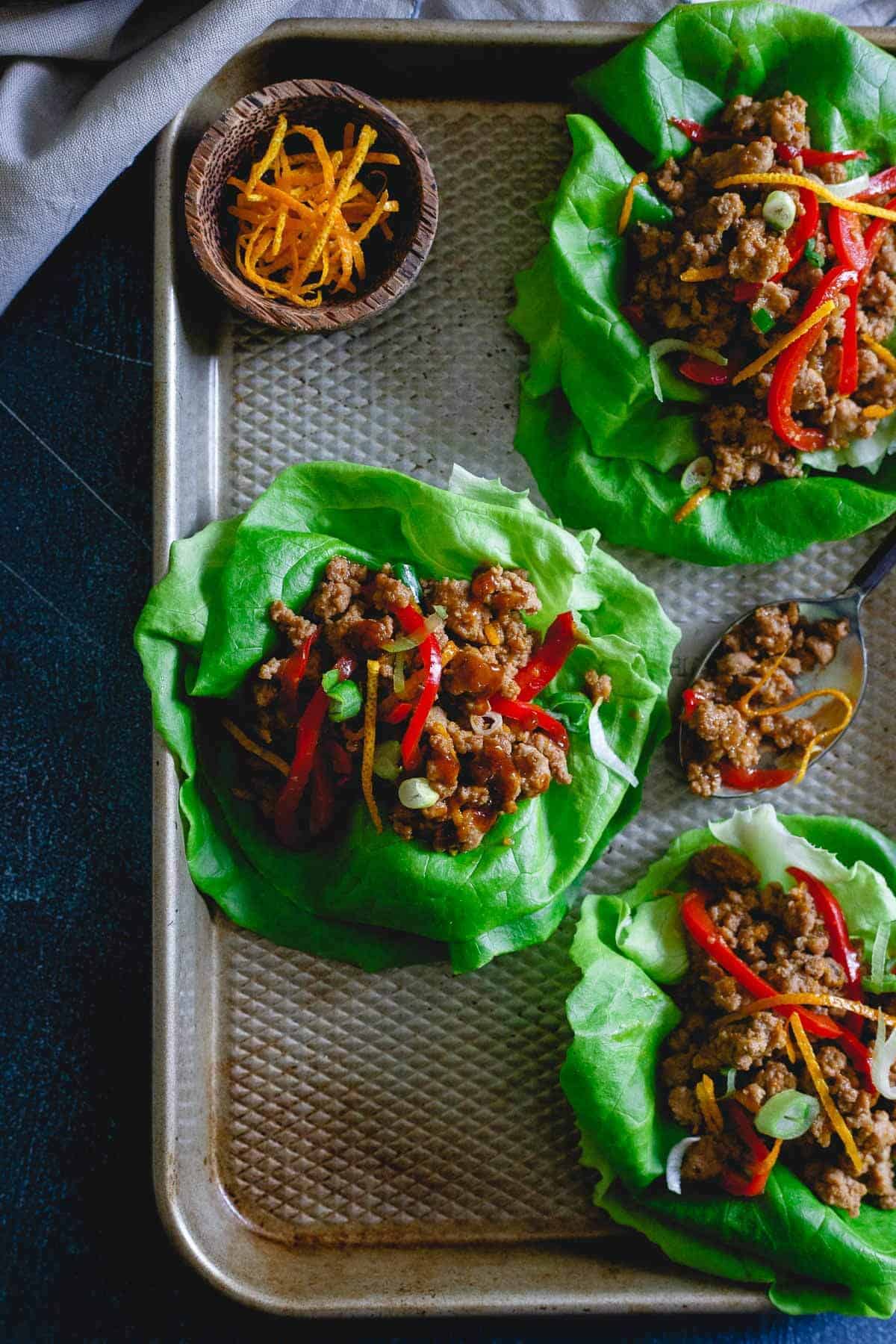 These turkey Asian lettuce wraps are infused with a sticky, sweet, savory and slightly spicy orange sauce making them an irresistibly easy and tasty meal.