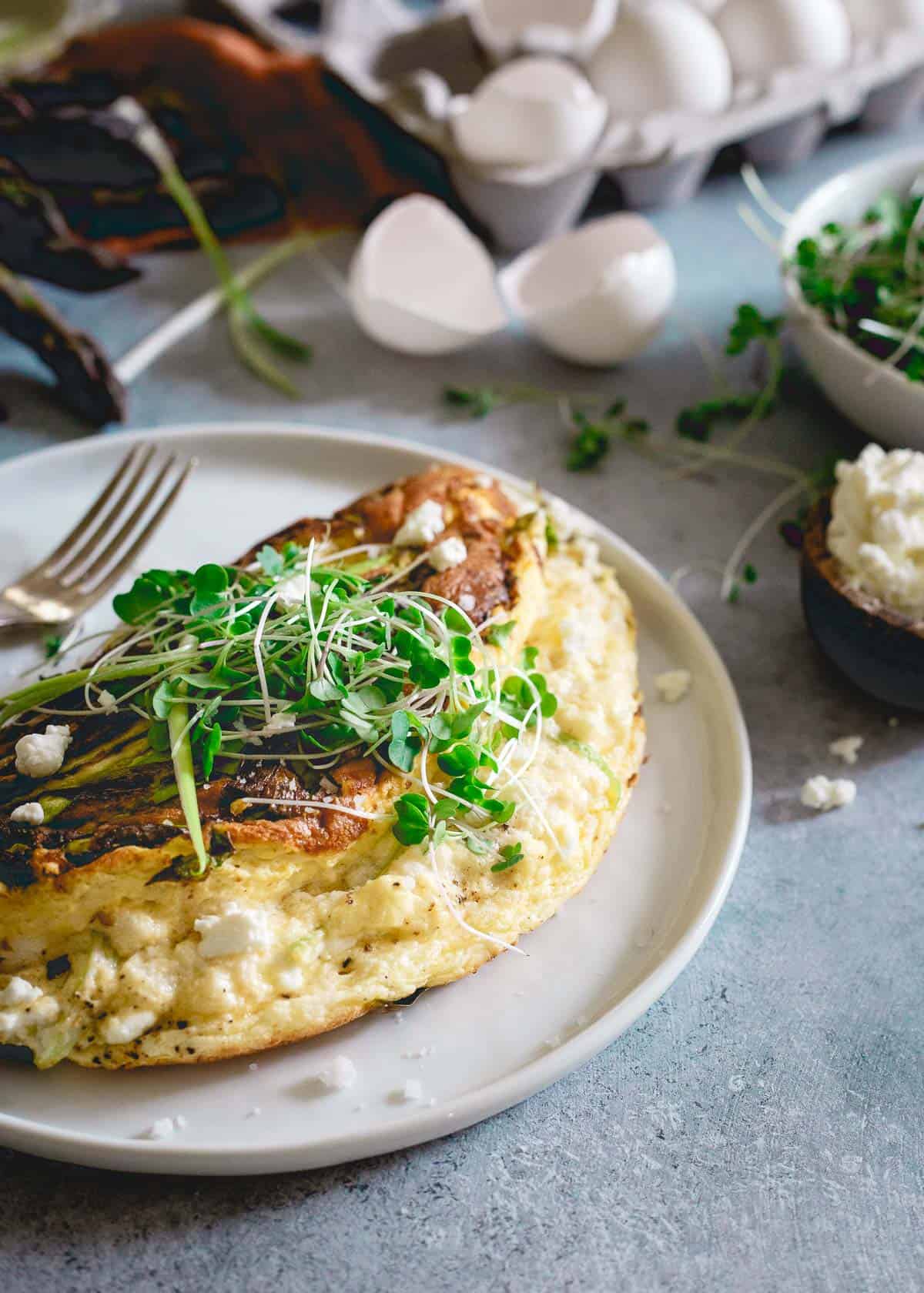 This omelette soufflé is a light and fluffy breakfast bursting with fresh spring ingredients like asparagus, green onions and creamy tart goat cheese.