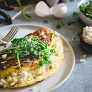 Asparagus omelette soufflé topped with microgreens.