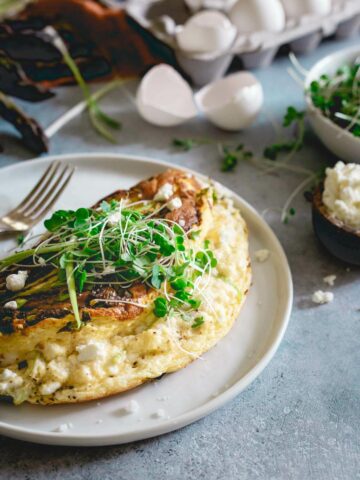 This omelette soufflé is a light and fluffy breakfast bursting with fresh spring ingredients like asparagus, green onions and optional creamy tart goat cheese.