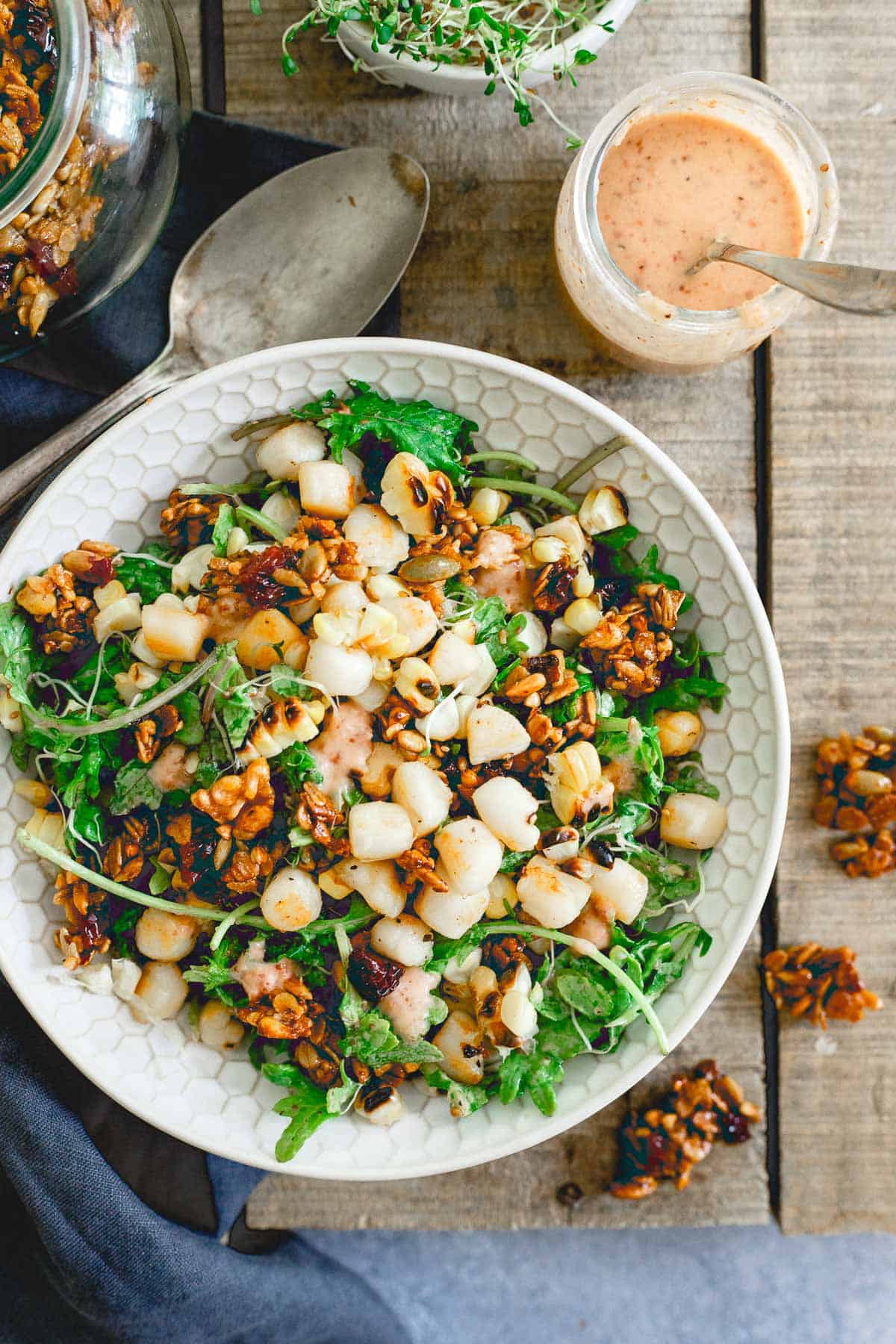 This bay scallop baby kale corn salad is served with a savory tart cherry granola and a cherry dijon dressing. Eating well in the summer never looked so good!