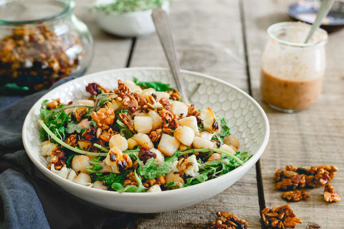 Summer salads don't have to be boring and this bay scallop baby kale and grilled corn one proves it. Topped with a savory tart cherry granola, it's healthy eating made delicious!