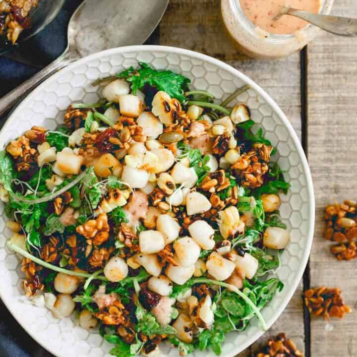 This bay scallop baby kale corn salad is served with a savory tart cherry granola and a cherry dijon dressing. Eating well in the summer never looked so good!
