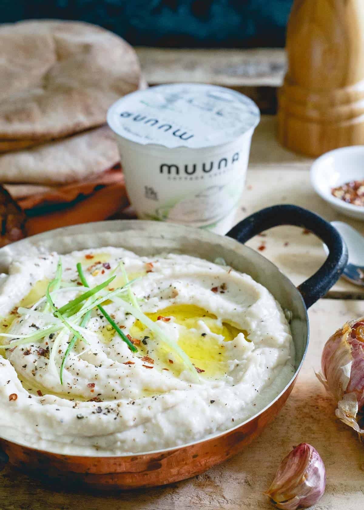 Cottage cheese is the perfect creamy addition to this roasted garlic white bean dip for an added healthy protein boost.