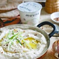 This roasted garlic white bean dip has a secret ingredient: cottage cheese! It lends a super creamy texture and healthy protein boost to each bite.
