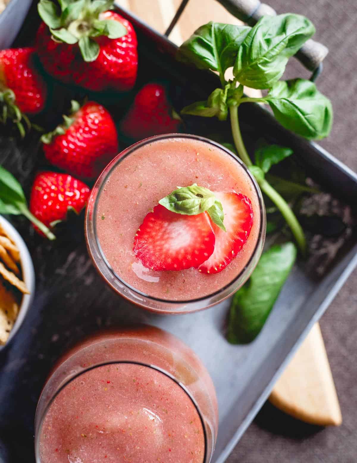 These strawberry basil cider slushies are the perfect refreshing summer drink. Just 3 ingredients and your blender for the happiest of happy hours!