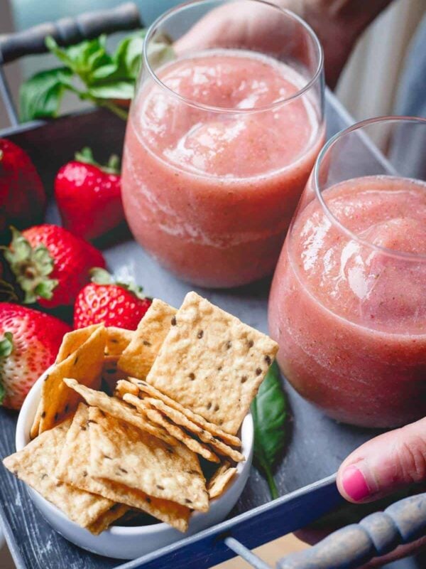 These strawberry basil cider slushies are the perfect refreshing summer drink. Just 3 ingredients and your blender for the happiest of happy hours!